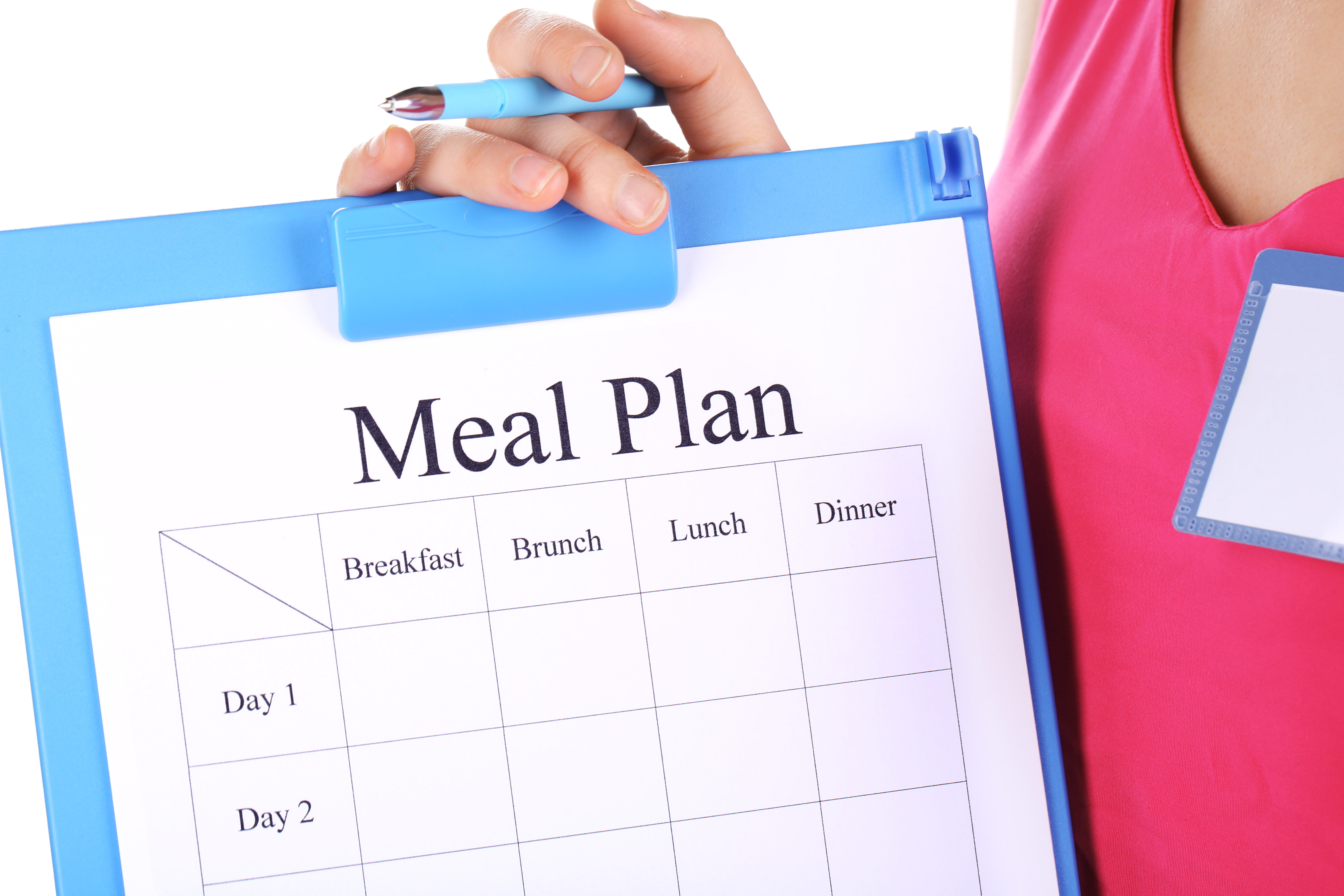 Sports trainer with meal program isolated on white Sports trainer with meal program isolated on white